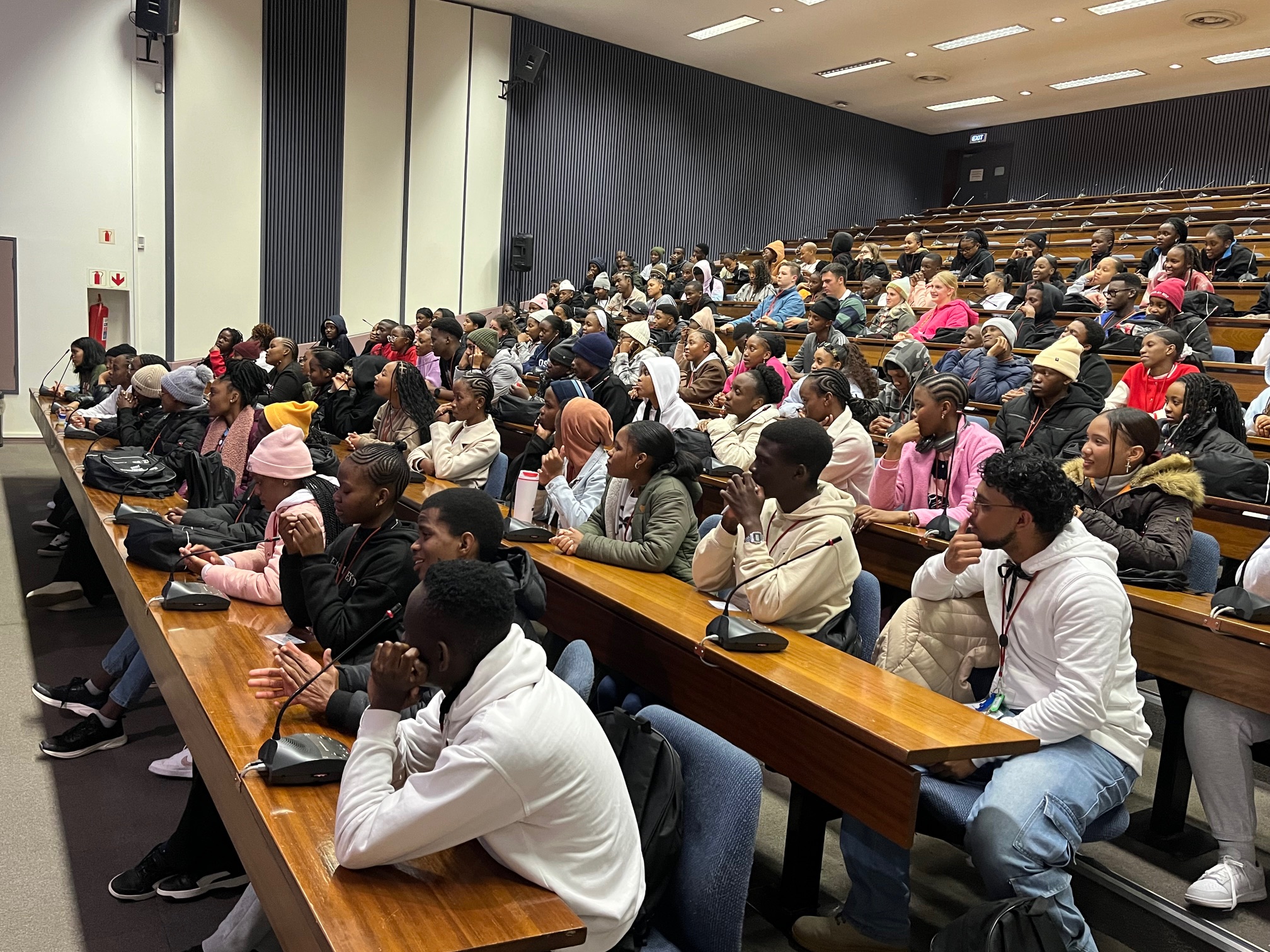 Diverse student audience in university setting